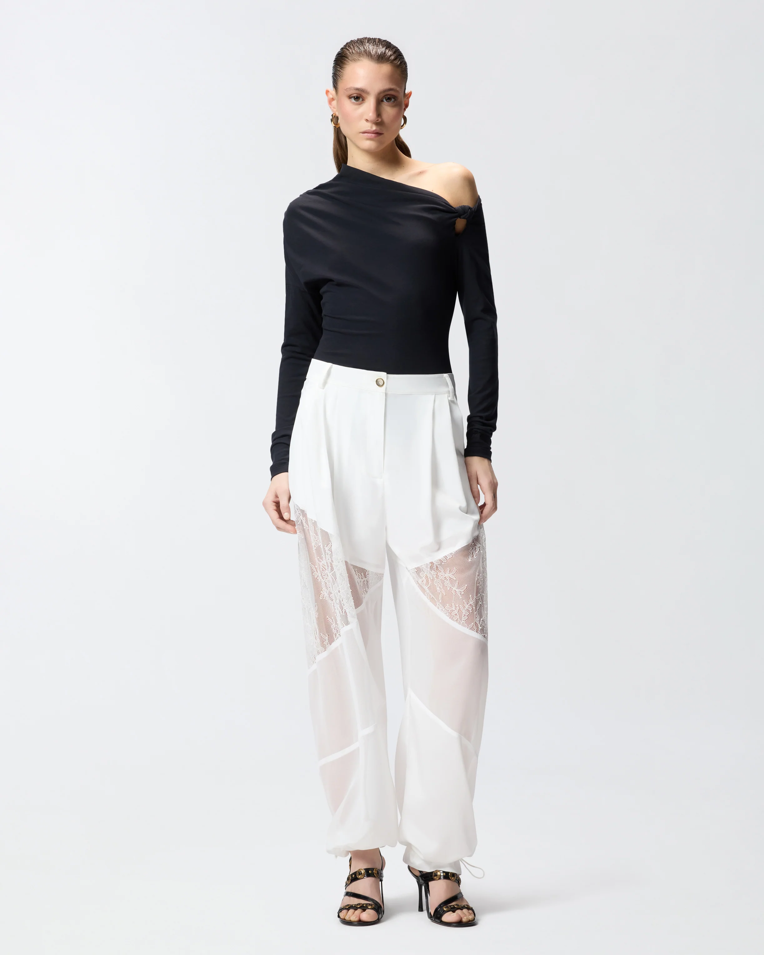 Pantaloni con dettagli in pizzo